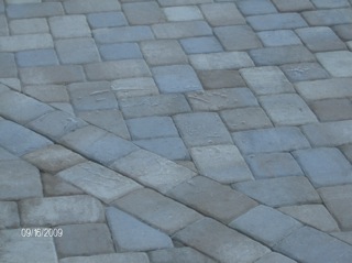 Pavers are easily taken up and reset if you need to access plumbing below