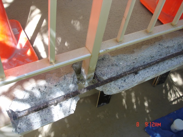Concrete failed around railing posts.  SCB&R can install railings in a way that prevents this problem.