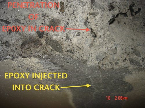 This is a crack that was injected next to a spall.(The spall was repaired after the injection to prevent the spall from increasing.) This photo shows the penetration of the epoxy.