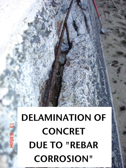 Rusting rebar has delaminated the concrete.
