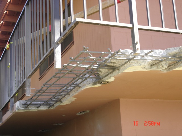Concrete removed and rebar treated with a rust inhibitor