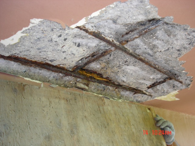 This spalling is due to rebar and electric conduit corrosion.